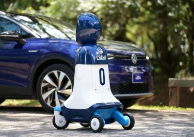 CHAMP Robot "posing" in front of the all-new Volkswagen ID.4 electric vehicle