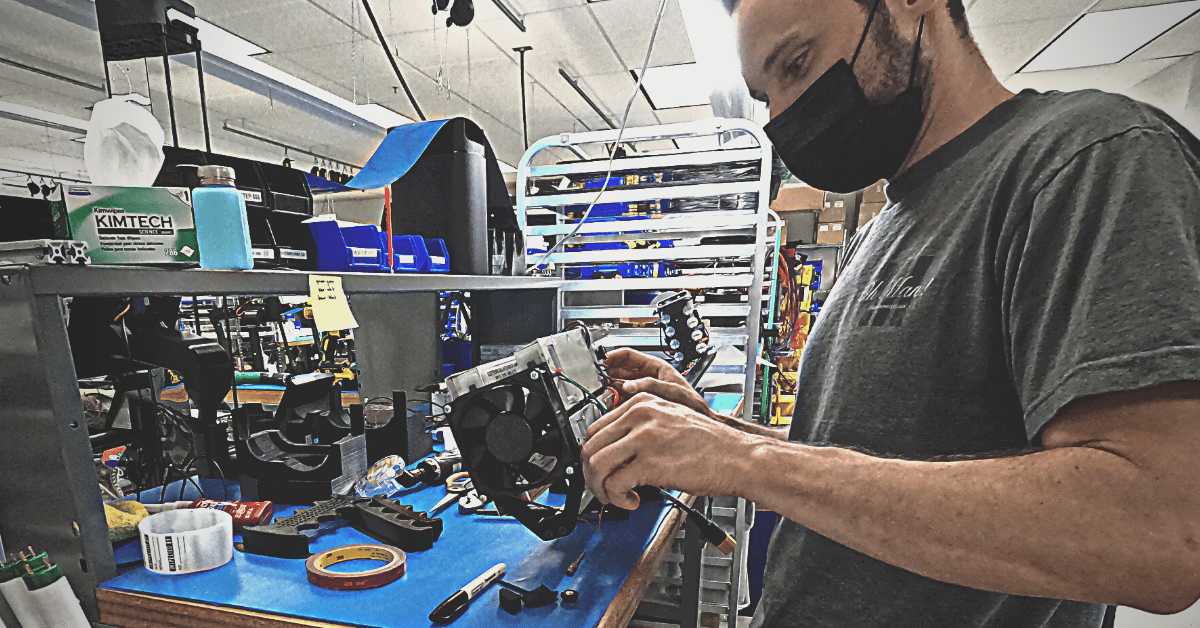 Technician building a robot in America.