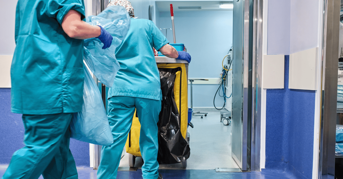 A hospital EVS crew cleaning a room.