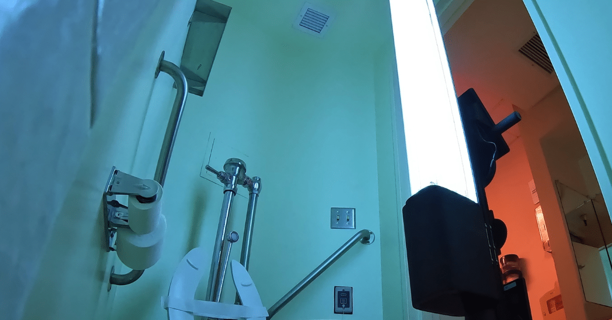 One of the OhmniClean sanitizing robots using UV-C to disinfect a bathroom.