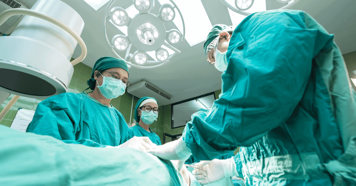 Doctors and staff performing an operation