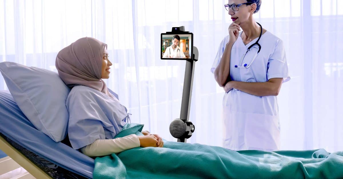 A doctor and patient using autonomous telepresence robot for care.