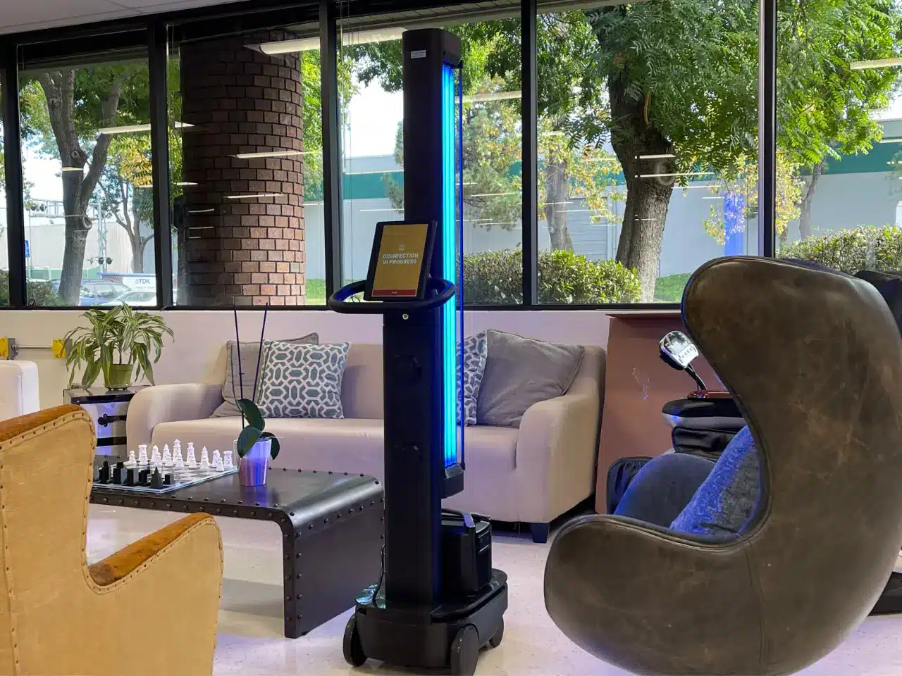 OhmniClean robot in a lobby for blog post on UV disinfection efficacy